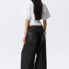 Astro Mid Rise Baggy Faux Leather Pocket Jeans – Black Rinse – Schwarz