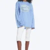 Bedrucktes Langarm-T-Shirt aus Baumwolle – Mittelblau – Swan Bedrucktes Langarm-T-Shirt aus Baumwolle – Mittelblau – Swan