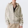 Boxy-Kapuzenpullover aus strukturiertem Strick mit Reißverschluss – hell gemustertes Beige Boxy-Kapuzenpullover aus strukturiertem Strick mit Reißverschluss – hell gemustertes Beige