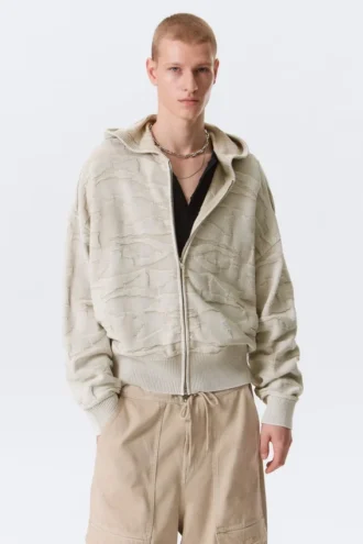 Boxy-Kapuzenpullover aus strukturiertem Strick mit Reißverschluss – hell gemustertes Beige