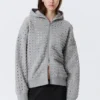 Boxy-Kapuzenpullover mit Reißverschluss und Lasercut – Grau meliert Boxy-Kapuzenpullover mit Reißverschluss und Lasercut – Grau meliert