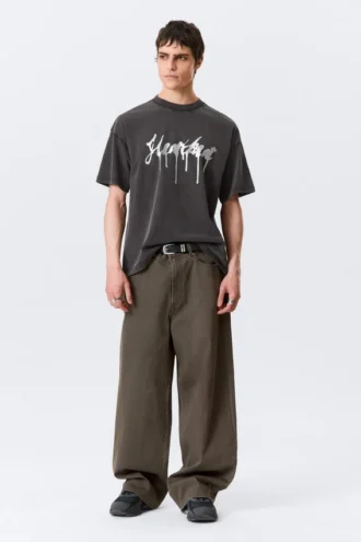 Boxy T-Shirt mit Print – Schwarz – Heartbeat