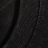 Geschrumpftes Baumwoll-T-Shirt mit kurzen Ärmeln – Abgenutztes Schwarz Geschrumpftes Baumwoll-T-Shirt mit kurzen Ärmeln – Abgenutztes Schwarz