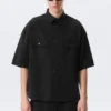 Kastenförmiges Baumwollhemd mit kurzen Shorts – Schwarz Kastenförmiges Baumwollhemd mit kurzen Shorts – Schwarz
