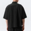 Kastenförmiges Baumwollhemd mit kurzen Shorts – Schwarz Kastenförmiges Baumwollhemd mit kurzen Shorts – Schwarz