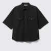 Kastenförmiges Baumwollhemd mit kurzen Shorts – Schwarz Kastenförmiges Baumwollhemd mit kurzen Shorts – Schwarz
