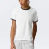 Kurzärmeliges Baumwoll-T-Shirt mit Kontrastbesatz – Weiß – Schwarzer Saum Kurzärmeliges Baumwoll-T-Shirt mit Kontrastbesatz – Weiß – Schwarzer Saum