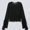 Langärmelige Bluse mit Rüschen – Schwarz Langärmelige Bluse mit Rüschen – Schwarz
