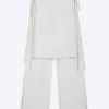Locker sitzende Hose mit Nieten und mittlerer Leibhöhe – Off-White Locker sitzende Hose mit Nieten und mittlerer Leibhöhe – Off-White
