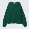Locker sitzender Strickpullover – Dunkelgrün meliert Locker sitzender Strickpullover – Dunkelgrün meliert