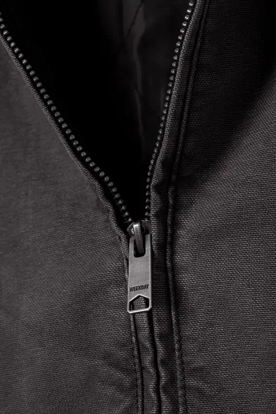 Lockere Canvas-Jacke mit Kapuze – Schwarz meliert Lockere Canvas-Jacke mit Kapuze – Schwarz meliert