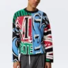 Lockerer, grafisch mit Print bedruckter Baumwoll-Pullover – mehrfarbiger Print Lockerer, grafisch mit Print bedruckter Baumwoll-Pullover – mehrfarbiger Print