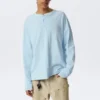 Lockeres langärmeliges Henley-T-Shirt – Hellblau Lockeres langärmeliges Henley-T-Shirt – Hellblau