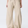 Lose Ballonhose mit niedriger Leibhöhe und Nieten – Beige Lose Ballonhose mit niedriger Leibhöhe und Nieten – Beige