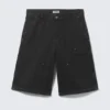 Lose sitzende Carpenter-Shorts mit niedriger Leibhöhe – Schwarz Lose sitzende Carpenter-Shorts mit niedriger Leibhöhe – Schwarz