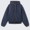 Lässige Bomberjacke mit Kapuze – gewaschenes Marineblau Lässige Bomberjacke mit Kapuze – gewaschenes Marineblau