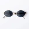 Minimalistische ovale Sonnenbrille aus Metall – Goldfarben – Dunkelblaue Gläser