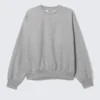 Sweatshirt in lockerer Passform – Grau meliert Sweatshirt in lockerer Passform – Grau meliert