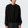 Sweatshirt in lockerer Passform – Schwarz Sweatshirt in lockerer Passform – Schwarz