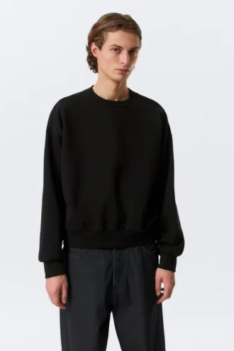 Sweatshirt in lockerer Passform – Schwarz