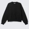 Sweatshirt in lockerer Passform – Schwarz Sweatshirt in lockerer Passform – Schwarz