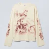 Tolles, kastenförmiges Langarmshirt mit Print – Staubweiß Tolles, kastenförmiges Langarmshirt mit Print – Staubweiß