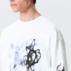 Tolles, kastenförmiges Langarmshirt mit Print – Weiß – Airways Tolles, kastenförmiges Langarmshirt mit Print – Weiß – Airways