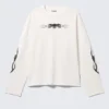 Tolles, kastenförmiges Langarmshirt mit Print – Weiß – Totenkopf-Flamme