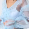 Transparente Bluse mit Rüschen und V-Ausschnitt – Hellblau Transparente Bluse mit Rüschen und V-Ausschnitt – Hellblau