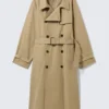 Weit geschnittener Zweireiher-Trenchcoat – Beige Weit geschnittener Zweireiher-Trenchcoat – Beige